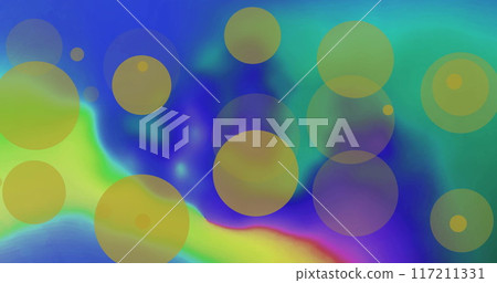 Image of yellow light spots over colourful shapes on blue background 117211331