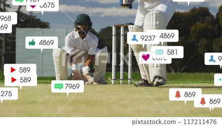 Image of social media icons with growing numbers over diverse male cricket players Image of social media icons with growing numbers over diverse male cricket players 117211476
