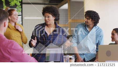 Business data analysis image over diverse team discussing in office Business data analysis image over diverse team discussing in office 117211525