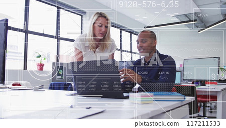 Analyzing data and collaborating over digital interface in modern office image 117211533