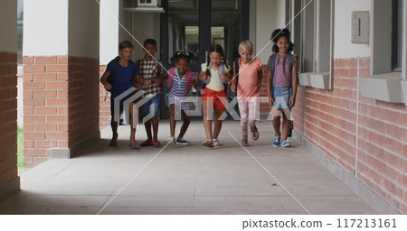 Image of back to school text over happy diverse school kids at school 117213161