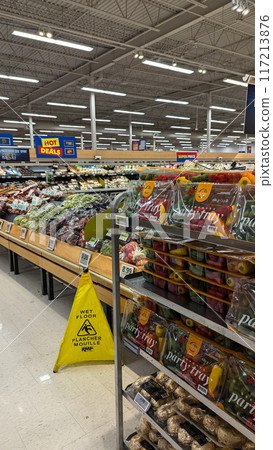 Fresh vegetables and fruits on the counter in a superstore. Fresh vegetables and fruits on the counter in a superstore. 117213876