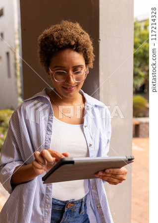 Using tablet, teenager studying and reading digital textbook for high school Using tablet, teenager studying and reading digital textbook for high school 117214328