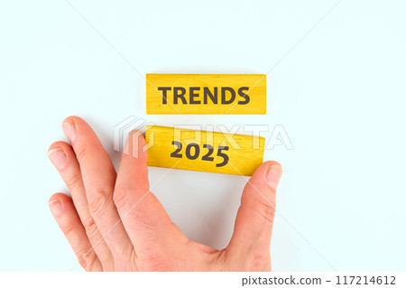 TRENDS 2025 text written inscription is made by hand from wooden blocks TRENDS 2025 text written inscription is made by hand from wooden blocks 117214612