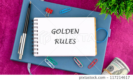 Conceptual golden rule symbol. Copy space. GOLDEN RULES words in a notebook on a blank page 117214617