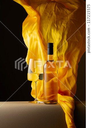 White wine and flutters of yellow cloth. White wine and flutters of yellow cloth. 117215575