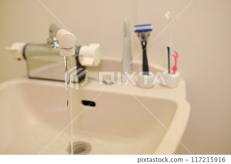Toothbrush and razor in the bathroom Toothbrush and razor in the bathroom 117215916