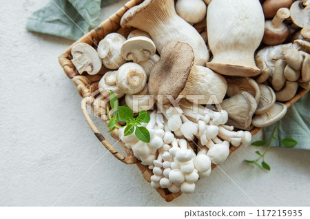 Assortment of various raw mushrooms Assortment of various raw mushrooms 117215935