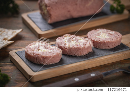 Slices of savory meatloaf with egg filling Slices of savory meatloaf with egg filling 117216671