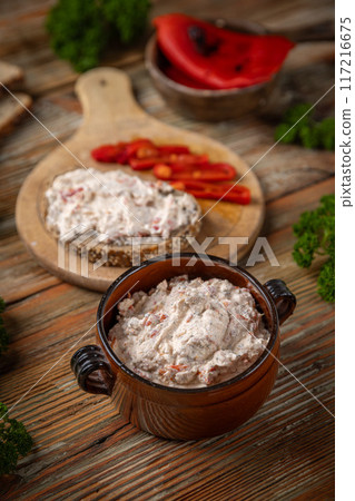 Rustic bowl filled with a cream cheese Rustic bowl filled with a cream cheese 117216675