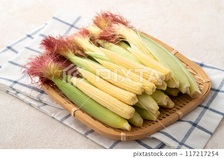 Corn tips, corn shoots, vegetables, baby corn husk 117217254