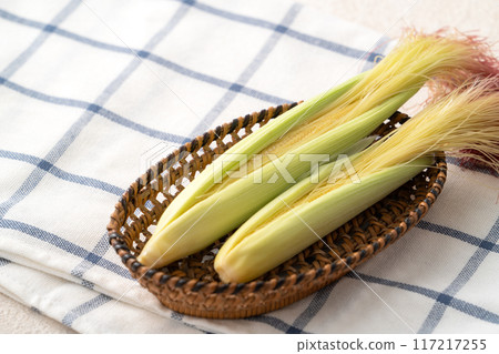 Corn tips, corn shoots, vegetables, baby corn husk 117217255