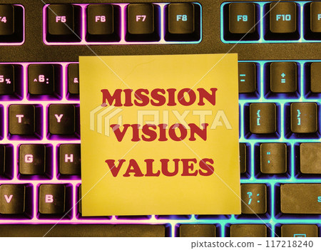 Mission vision values symbol. Concept words Mission Vision Values on a yellow sticker on the background of a backlit keyboard Mission vision values symbol. Concept words Mission Vision Values on a yellow sticker on the background of a backlit keyboard 117218240
