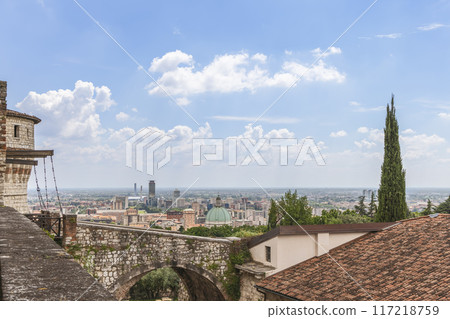 Drawbridge arched entrance of Brescia medieval castle overlooking historic center modern district Drawbridge arched entrance of Brescia medieval castle overlooking historic center modern district 117218759