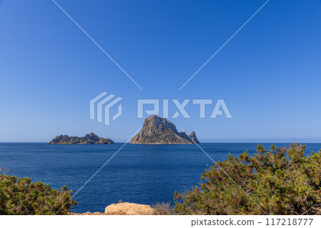 Stunning view of Es Vedra and Es Vedranell islands off Ibiza coast, deep blue Mediterranean Sea 117218777