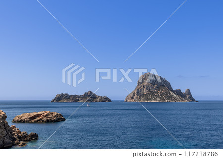 Scenic panorama of Es Vedra and Es Vedranell islets in Ibiza, Spain, azure Mediterranean waters 117218786