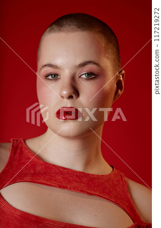 Minimal closeup portrait of sensual young girl with short hair looking at camera wearing red lipstick Minimal closeup portrait of sensual young girl with short hair looking at camera wearing red lipstick 117219272