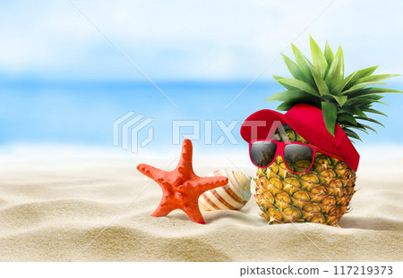 Experience a vibrant Tropical Fun moment A delightful Pineapple wearing Sunglasses on a Beach 117219373