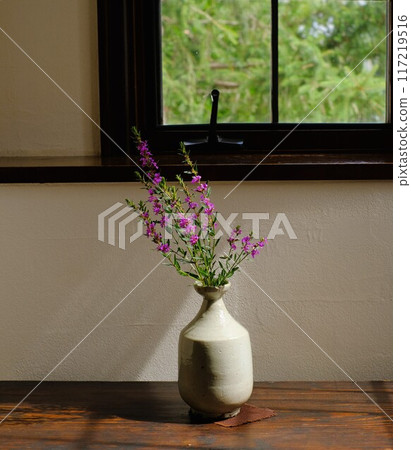 Windowsill with a vase Windowsill with a vase 117219516