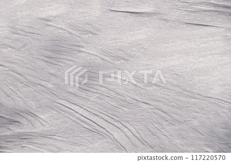 Snowy gray background with frosty glitter and natural streaks from the wind Snowy gray background with frosty glitter and natural streaks from the wind 117220570