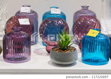 Colored glass vases are sold in store. Jars for bouquets of flowers. Colored glass vases are sold in store. Jars for bouquets of flowers. 117220897