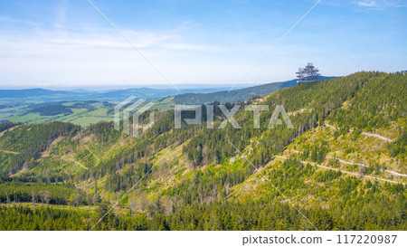 A panoramic view of the forested landscape surrounding the Sky Walk lookout tower, located in the Dolni Morava Resort in Czechia. 117220987