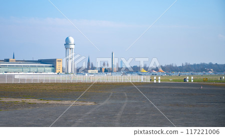 A clear view of Berlins historic Tempelhof Airport termina building with the radar tower. Blue sky backdrop. Berlin, Germany 117221006