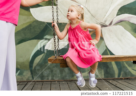 Child walks with cochlear implant system. Installation cochlear implant on child girl ear for restores hearing. Kid hears after hear return to normal. Diversity inclusion concept. Copy space Child walks with cochlear implant system. Installation cochlear implant on child girl ear for restores hearing. Kid hears after hear return to normal. Diversity inclusion concept. Copy space 117221515