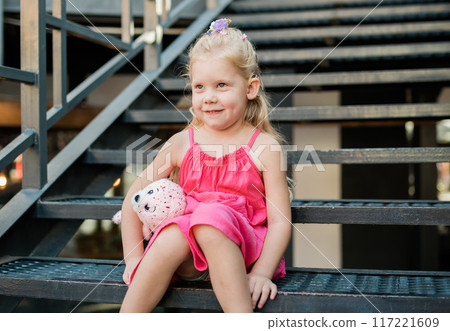 Child walks with cochlear implant system. Installation cochlear implant on child girl ear for restores hearing. Kid hears after hear return to normal. Diversity inclusion concept. 117221609