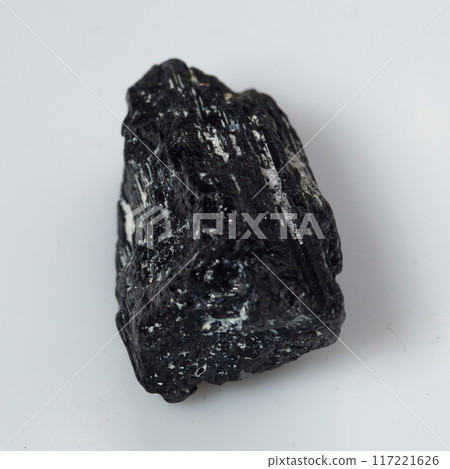 natural black tourmaline scherl on the white background 117221626