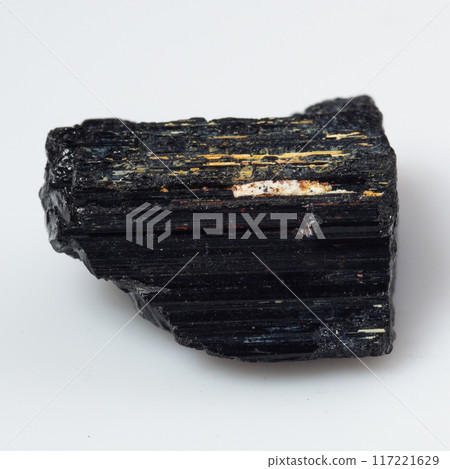 natural black tourmaline scherl on the white background natural black tourmaline scherl on the white background 117221629