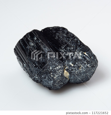 natural black tourmaline scherl on the white background natural black tourmaline scherl on the white background 117221652