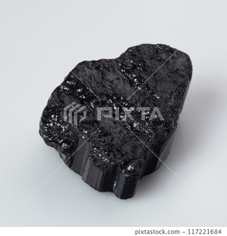 natural black tourmaline scherl on the white background natural black tourmaline scherl on the white background 117221684