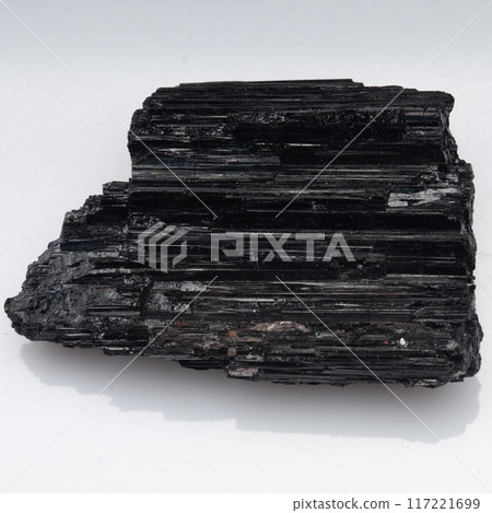 natural black tourmaline scherl on the white background natural black tourmaline scherl on the white background 117221699