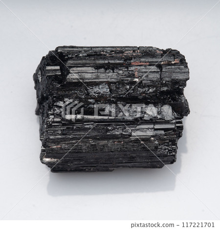 natural black tourmaline scherl on the white background natural black tourmaline scherl on the white background 117221701