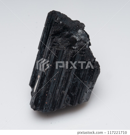 natural black tourmaline scherl on the white background natural black tourmaline scherl on the white background 117221710