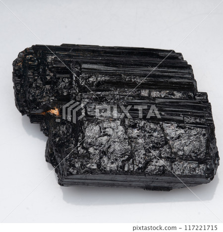 natural black tourmaline scherl on the white background natural black tourmaline scherl on the white background 117221715