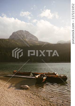 View of the Black Lake or Crno jezero , northern Montenegro. Tourist boats near wooden pier on Black lake in Durmitor national park near Zabljak, Europe 117221852