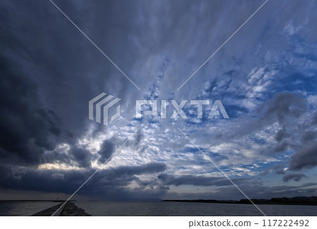 Evening sky with various clouds spreading across the sky and the harbor, ultra-wide angle, sky-focused, 231220pm 117222492
