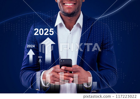 A man is holding a cell phone and smiling A man is holding a cell phone and smiling 117223022