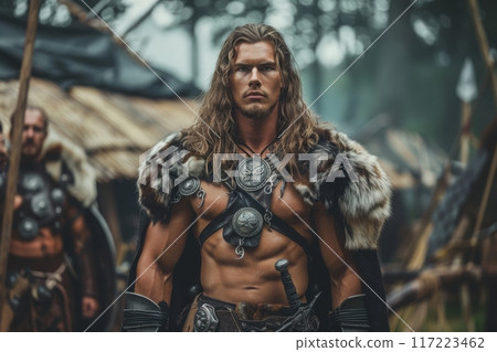 A powerful Celtic warrior stands resolute in a forest clearing, adorned in furs and armor, embodying strength and bravery as twilight descends around him. 117223462