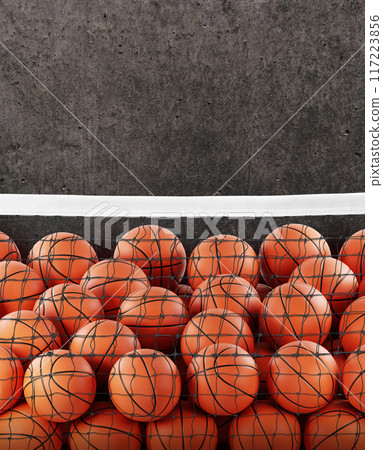 Several basketball balls in the net. Cement background. 117223856