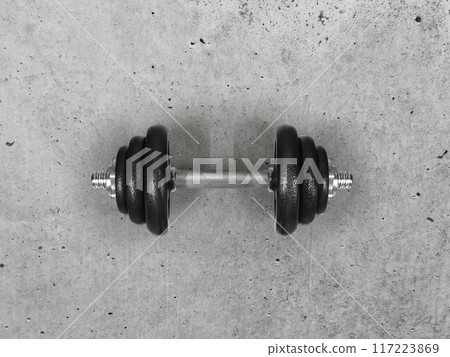 Dumbbells placed on the cement floor top view Dumbbells placed on the cement floor top view 117223869