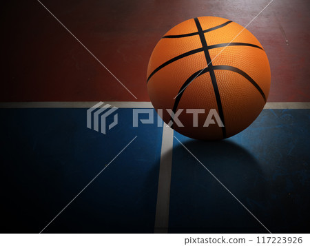 A basketball is placed on the red and green surface of the basketball court. A basketball is placed on the red and green surface of the basketball court. 117223926