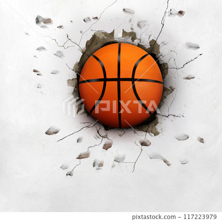 The basketball pierced the white wall with mighty power. The basketball pierced the white wall with mighty power. 117223979