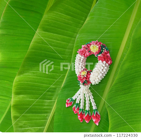 Handmade jasmine garland, a symbol of Mother's Day in Thailand. on banana leaf background 117224330