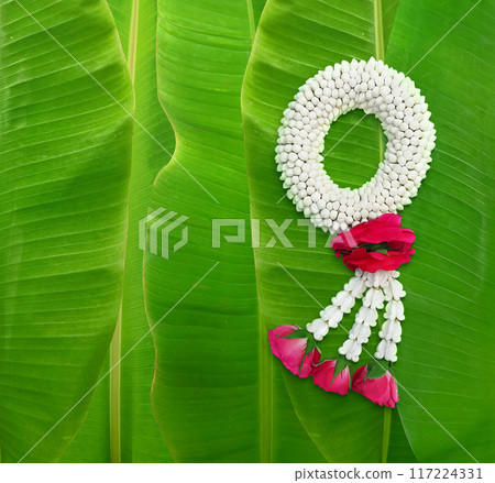 Handmade jasmine garland, a symbol of Mother's Day in Thailand. on banana leaf background 117224331