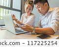 Young business team discuss about information on laptop 117225254