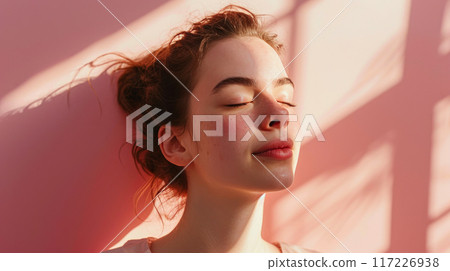 Luminous Relaxation: Close-Up of a Woman's Serene Expression Luminous Relaxation: Close-Up of a Woman's Serene Expression 117226938