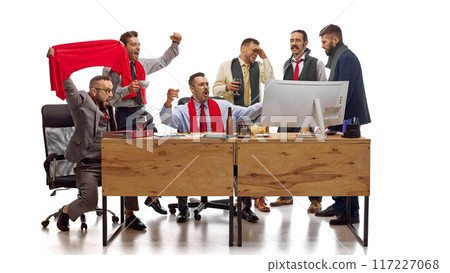 Workers, men, football fans watching football match and drinks beer online while working in office against white studio background. 117227068